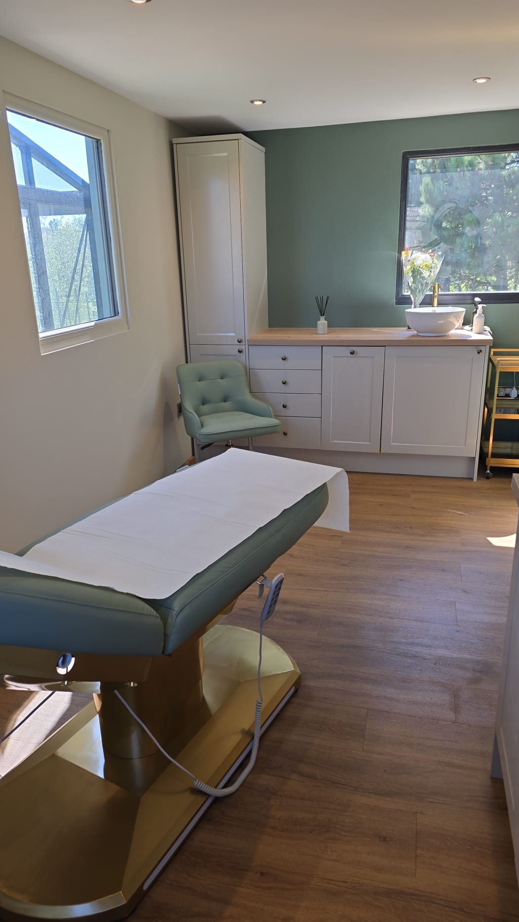 Treatment room with medical couch and natural light
